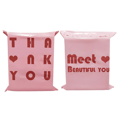 100ミクロンのピンクのポリエチレン製のプラスチック製の郵送用バッグは、衣類のパッケージ輸送を急行します